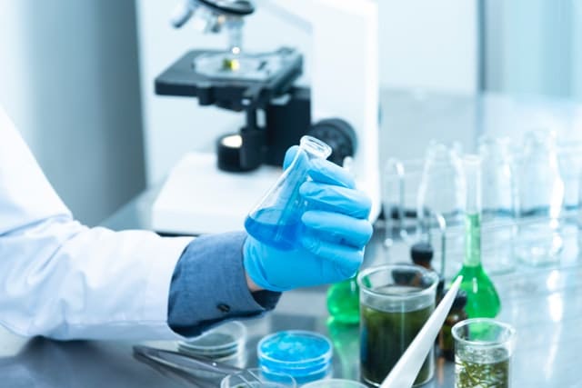 scientist holding a lab flask