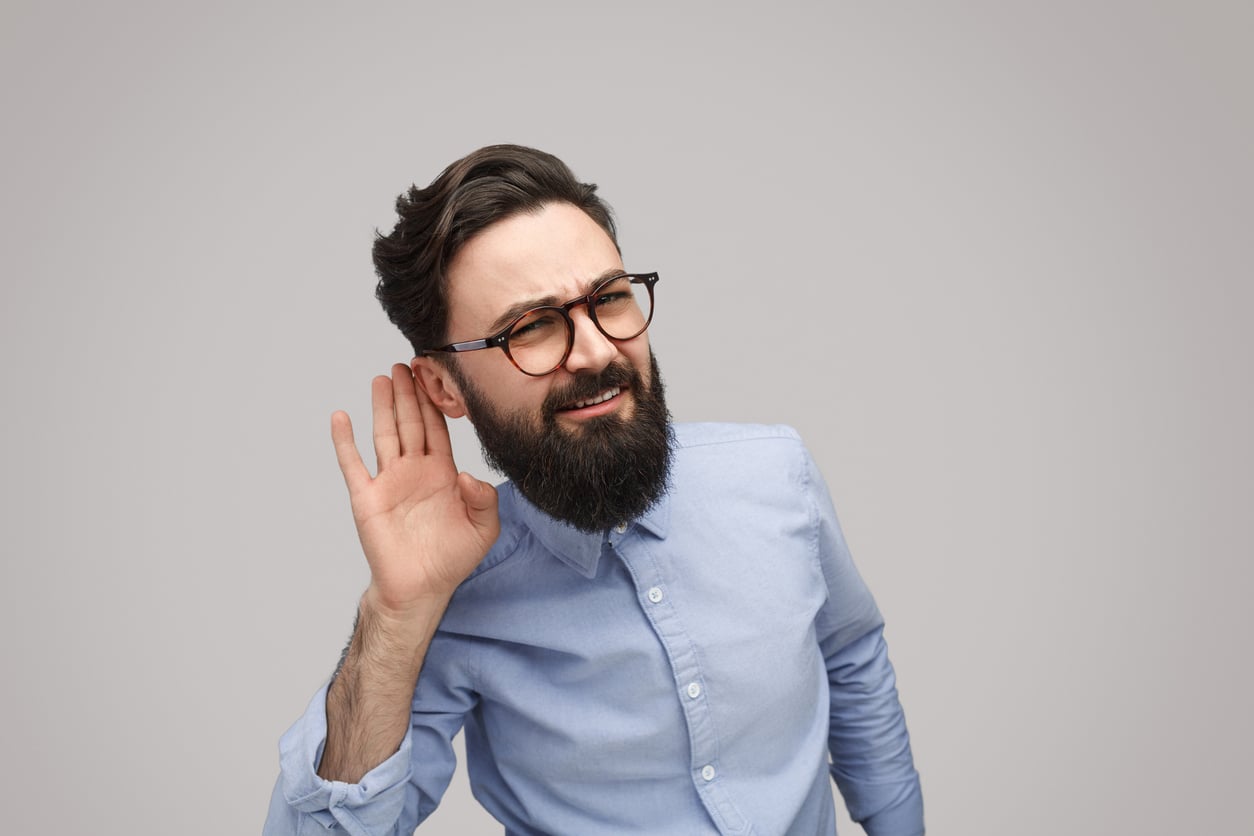 Bearded man listening closely