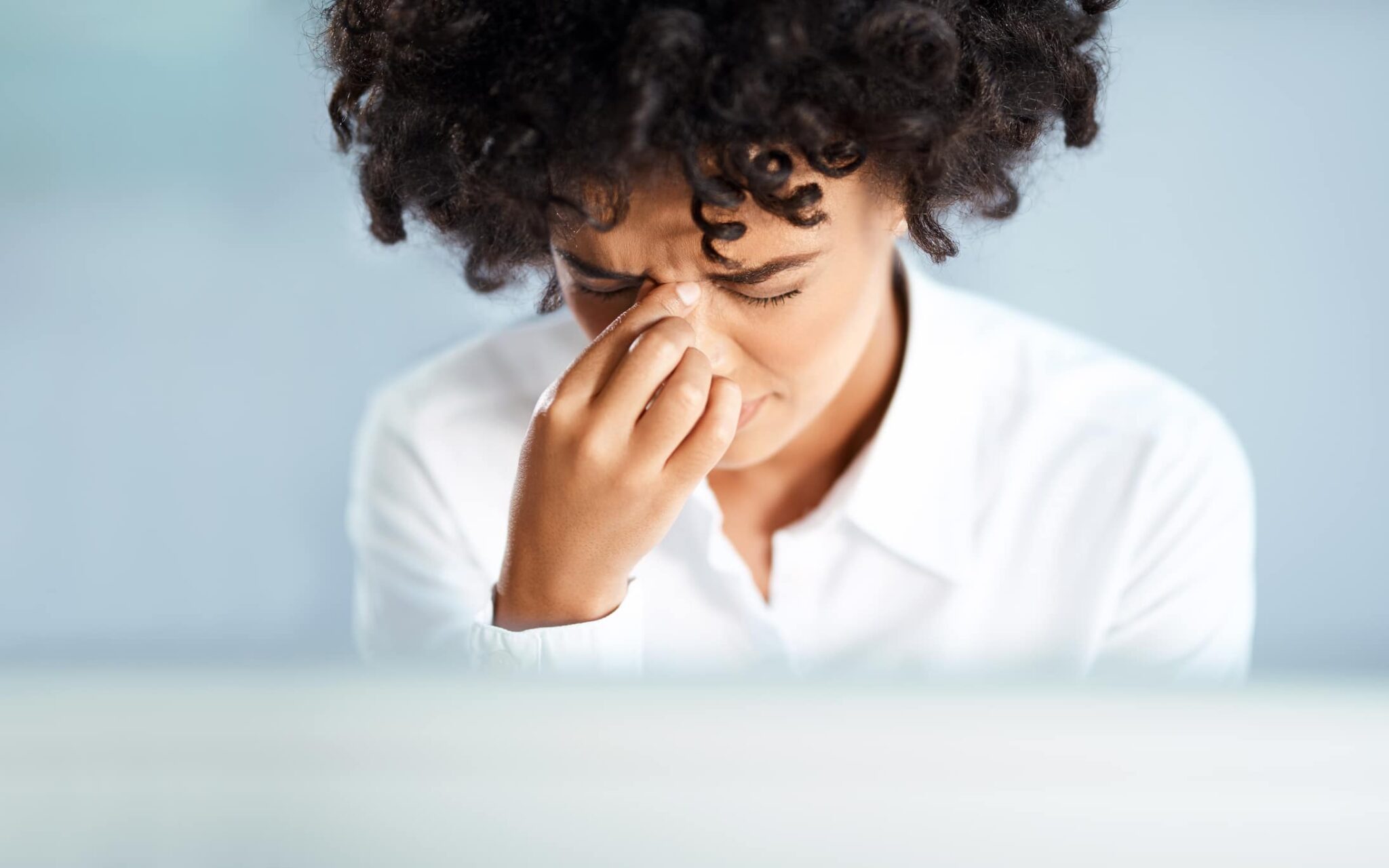 Woman with sinus pain.