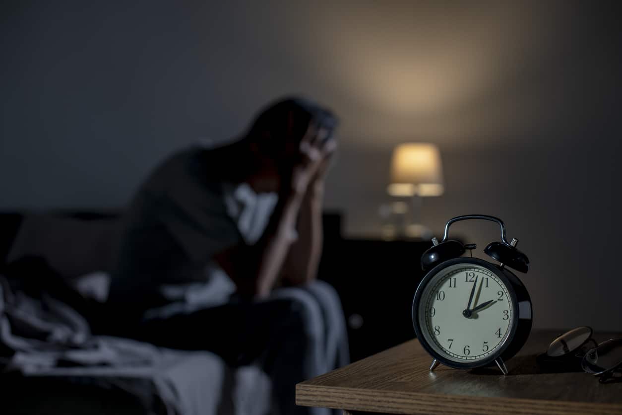 Man awake in bed